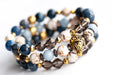 Handmade gemstone bracelet set featuring Smoky Quartz, Angelite, Dumortierite, petrified wood, and shell beads with gold accents
