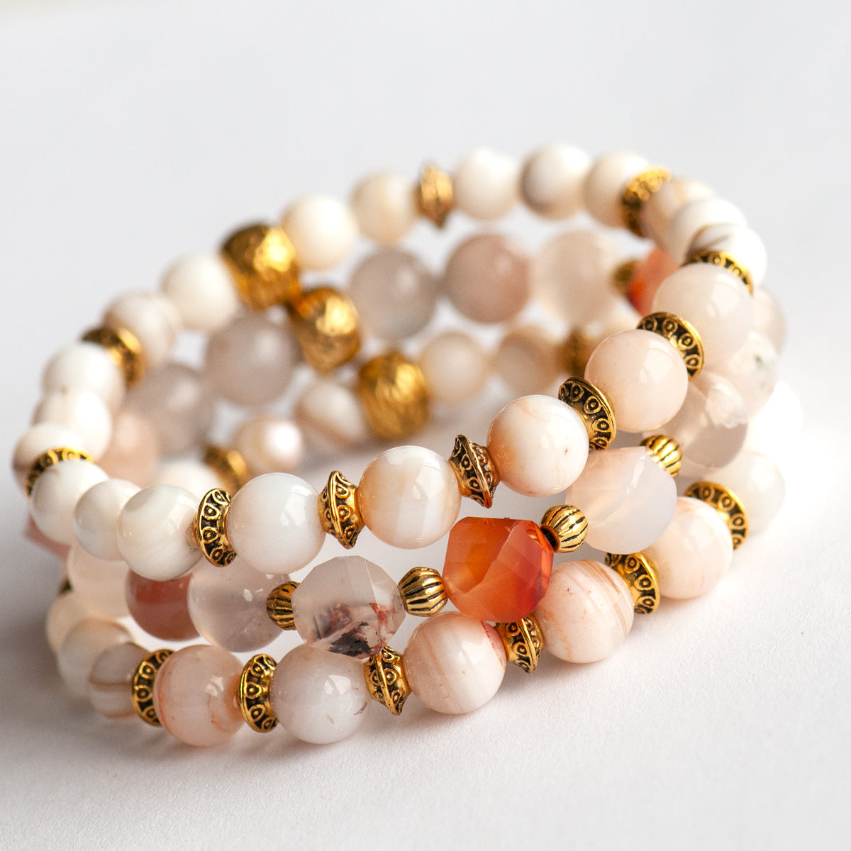 Peaches and Cream handmade gemstone bracelet set with cherry blossom agate beads and gold accents