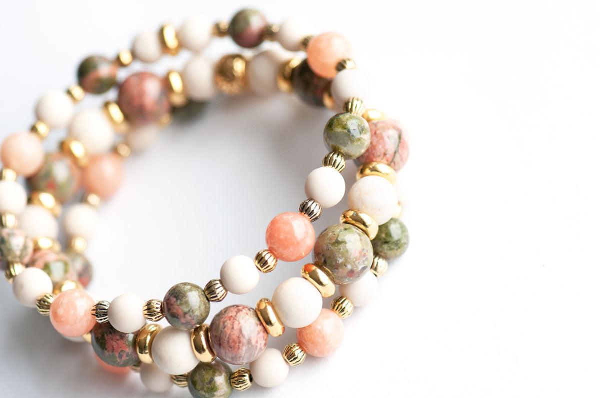 Green and salmon gemstone bracelet with gold accents