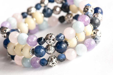 Gentle Lynx - handmade gemstone bracelet set with navy sodalite, morganite, aquamarine, and yellow jade. 