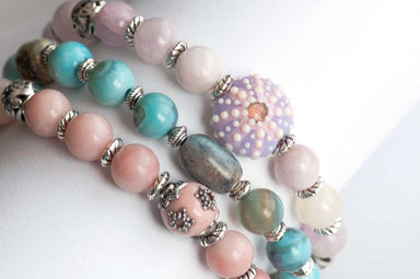 Walk on the Beach bracelet stack with lilac Kunzite, pink opals, and terra agate
